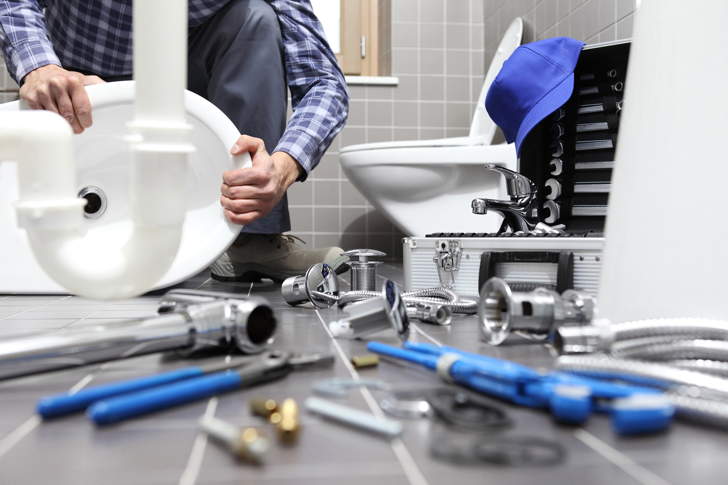 Licensed Blue Moon plumber working on a repair in Dallas