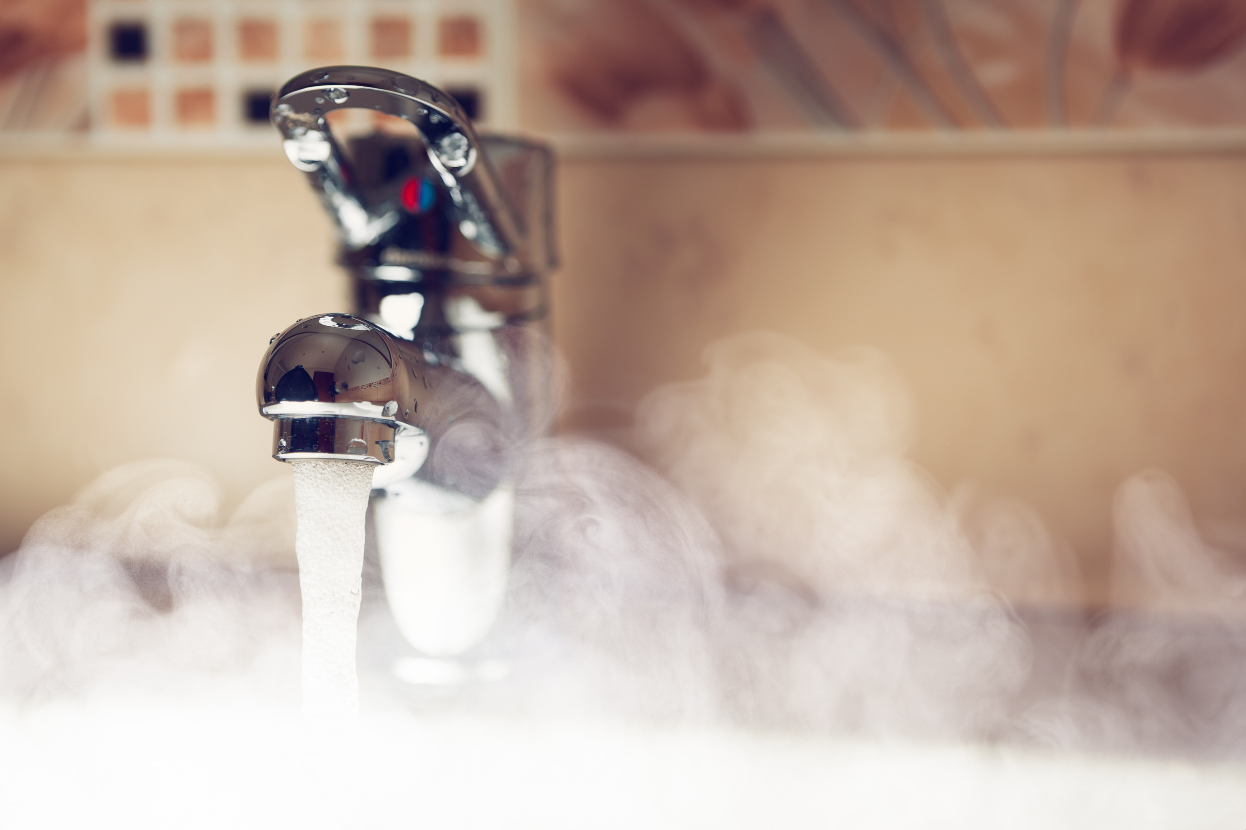 Hot water running from a tap after a water heater repair