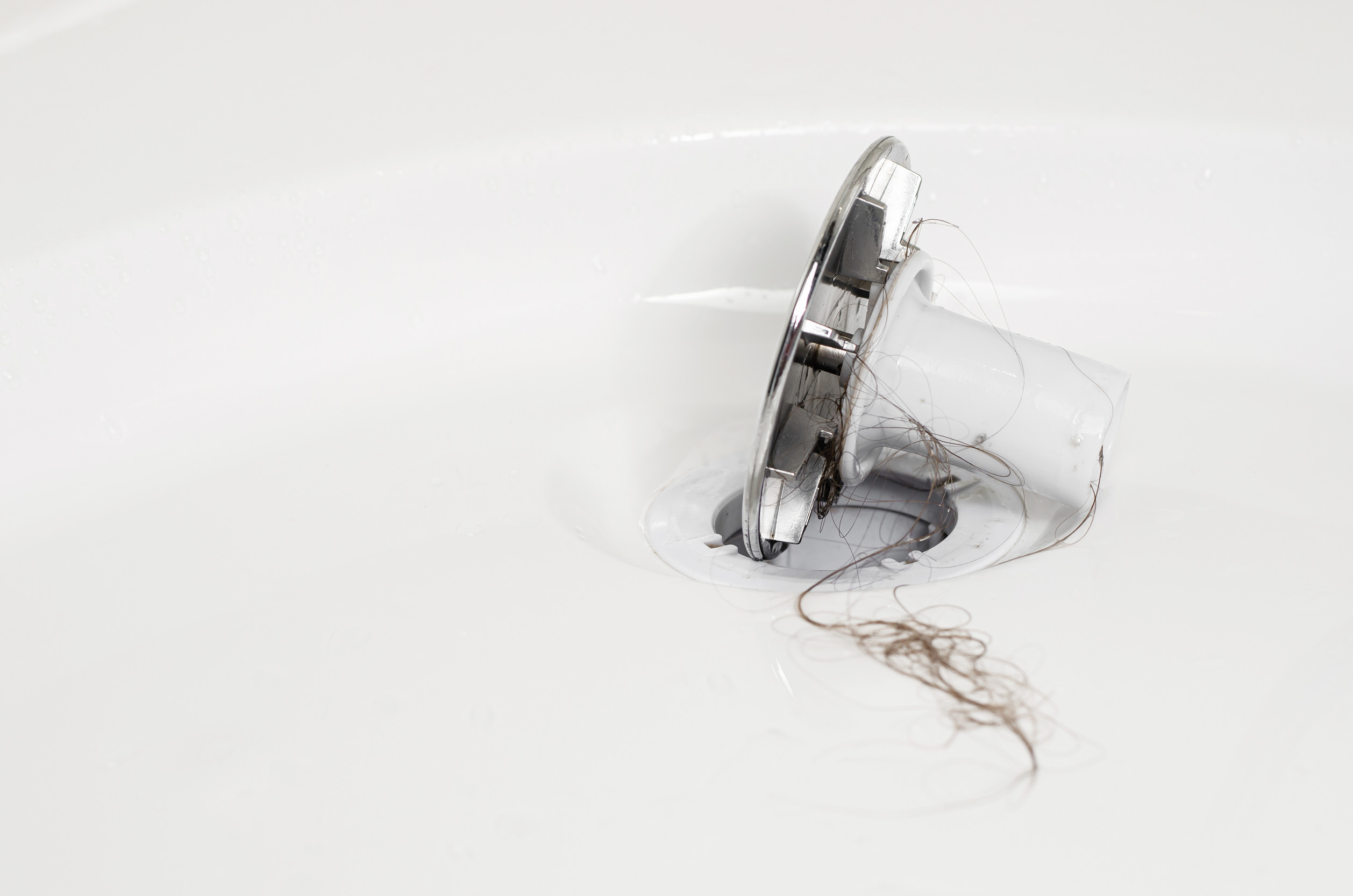 how to use a drain snake auger